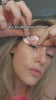 woman applying Aquivelle peptide collagen hydrogel eye patches under eyes skincare routine